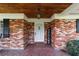 Inviting brick porch features a decorative welcome sign and stylish ceiling detail at 1300 Ne 53Rd St, Ocala, FL 34479