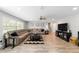 Bright living room featuring a plush sectional sofa, modern decor, and ample natural light at 1300 Ne 53Rd St, Ocala, FL 34479