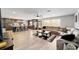 Open concept living area with kitchen island and comfortable seating at 1300 Ne 53Rd St, Ocala, FL 34479