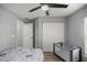 Bedroom featuring a ceiling fan, closet, and a playpen at 13458 Sw 113Th Pl, Dunnellon, FL 34432