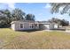 House exterior featuring a well-manicured front lawn at 13458 Sw 113Th Pl, Dunnellon, FL 34432