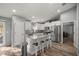 Bright kitchen featuring white cabinets, stainless steel appliances, granite counters, and a center island at 13458 Sw 113Th Pl, Dunnellon, FL 34432