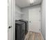 Laundry room featuring a washer, dryer, and shelving unit at 13458 Sw 113Th Pl, Dunnellon, FL 34432