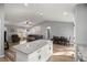 Bright, open floorplan connecting the living room, dining area, and kitchen with an island at 13458 Sw 113Th Pl, Dunnellon, FL 34432
