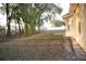 Spacious backyard with mature trees, offering ample space for recreation at 13700 Sw 48Th Ct, Ocala, FL 34473