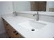 Bathroom featuring double sinks, modern faucet fixtures, and a white countertop with cabinets below at 13700 Sw 48Th Ct, Ocala, FL 34473