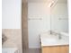 Bright bathroom featuring a double sink vanity with neutral toned tile on walls at 13700 Sw 48Th Ct, Ocala, FL 34473