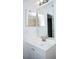 Bright bathroom with vanity, modern faucet, and dual mirrors at 13700 Sw 48Th Ct, Ocala, FL 34473