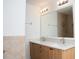 Bathroom featuring double sink, wood cabinets, and tile shower/tub combo at 13700 Sw 48Th Ct, Ocala, FL 34473
