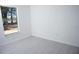 Empty bedroom features neutral walls and floors with large window at 13700 Sw 48Th Ct, Ocala, FL 34473