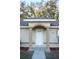 Inviting front entrance with decorative columns at 13700 Sw 48Th Ct, Ocala, FL 34473