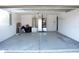 Spacious two-car garage with painted floor and modern mechanical equipment at 13700 Sw 48Th Ct, Ocala, FL 34473