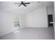 Open concept living room featuring vaulted ceilings and modern ceiling fan at 13700 Sw 48Th Ct, Ocala, FL 34473