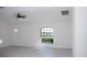 Living room featuring modern ceiling fan, light grey floors, and neutral paint at 13700 Sw 48Th Ct, Ocala, FL 34473