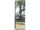 A window view of a lush backyard featuring trees at 13700 Sw 48Th Ct, Ocala, FL 34473