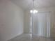 Bright dining area with tile floor, light fixture, and sliding glass door to the patio at 15756 Sw 37Th Cir, Ocala, FL 34473