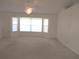Spacious living room with a large bay window allowing for lots of natural light at 15756 Sw 37Th Cir, Ocala, FL 34473
