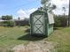 A green and white shed with a gable roof and double doors is in the yard at 15756 Sw 37Th Cir, Ocala, FL 34473