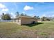 Backyard view of this home showing the exterior and yard at 159 Water Trak, Ocala, FL 34472
