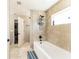 Bathroom showing bathtub with tiled walls and a shower head fixture at 159 Water Trak, Ocala, FL 34472
