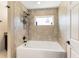 Bathroom showing bathtub with tiled walls and a shower head fixture at 159 Water Trak, Ocala, FL 34472