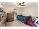 Bedroom with a twin bed, dresser, and a ceiling fan at 159 Water Trak, Ocala, FL 34472