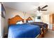 Cozy bedroom with two twin beds, a ceiling fan, and natural light, creating a serene space at 159 Water Trak, Ocala, FL 34472
