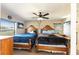 Inviting bedroom with two beds, a ceiling fan, and bright windows for lots of light at 159 Water Trak, Ocala, FL 34472