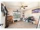 Bedroom includes window with blinds, ceiling fan, and carpet flooring at 159 Water Trak, Ocala, FL 34472