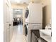 Laundry room with stackable washer and dryer, additional storage at 159 Water Trak, Ocala, FL 34472