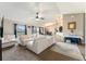 Spacious living room with neutral color palette, vaulted ceilings, and sliding door to the outside at 159 Water Trak, Ocala, FL 34472