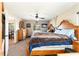 Spacious bedroom with ceiling fan, dresser, and an attached dining room at 159 Water Trak, Ocala, FL 34472