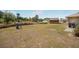 A spacious backyard with a fence, a utility shed, and some foliage along the fence line at 17 Pine Course Loop, Ocala, FL 34472