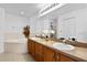 Bathroom boasts a large vanity with double sinks and a soaking tub at 17 Pine Course Loop, Ocala, FL 34472