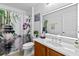 Bright bathroom features a modern sink, vanity, and zen-themed shower curtain at 17 Pine Course Loop, Ocala, FL 34472