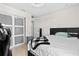Bright bedroom features modern sliding door closet and contemporary design at 17 Pine Course Loop, Ocala, FL 34472
