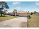 Charming single-story home featuring a two-car garage and well-maintained front lawn at 17 Pine Course Loop, Ocala, FL 34472
