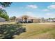 Charming single-story home featuring a two-car garage and well-maintained front lawn at 17 Pine Course Loop, Ocala, FL 34472
