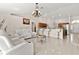 Expansive living space with tile flooring, neutral walls, and open access to the kitchen and dining areas at 17 Pine Course Loop, Ocala, FL 34472