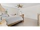 Main bedroom features a ceiling fan, interior door and stylish design at 17 Pine Course Loop, Ocala, FL 34472
