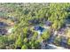 Aerial shot of a secluded home surrounded by mature trees and nature, boasting a private pool at 17710 Sw 48Th Pl, Dunnellon, FL 34432