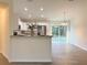 Modern kitchen featuring white cabinetry, granite countertops, and stainless steel appliances at 17710 Sw 48Th Pl, Dunnellon, FL 34432