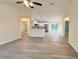 Open-concept living space connecting the kitchen, dining, and living areas, perfect for entertaining guests at 17710 Sw 48Th Pl, Dunnellon, FL 34432