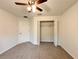 A bedroom with a closet and ceiling fan at 17710 Sw 48Th Sw Pl, Dunnellon, FL 34432