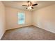 This spacious bedroom has carpeted flooring and is brightly lit by the large window at 17710 Sw 48Th Sw Pl, Dunnellon, FL 34432