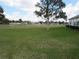Backyard view of vast green space with distant homes and trees at 2459 Nw 55Th Avenue Rd, Ocala, FL 34482