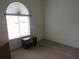 Spare bedroom with a window and neutral carpeting at 2459 Nw 55Th Avenue Rd, Ocala, FL 34482