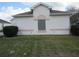 Exterior view of home with well-maintained landscaping and large window at 2459 Nw 55Th Avenue Rd, Ocala, FL 34482