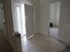 Spacious foyer featuring tile flooring, a bright entrance, and open doorway to another room at 2459 Nw 55Th Avenue Rd, Ocala, FL 34482