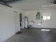 Spacious garage featuring laundry area, utility sink, and ample room for parking and storage at 2459 Nw 55Th Avenue Rd, Ocala, FL 34482